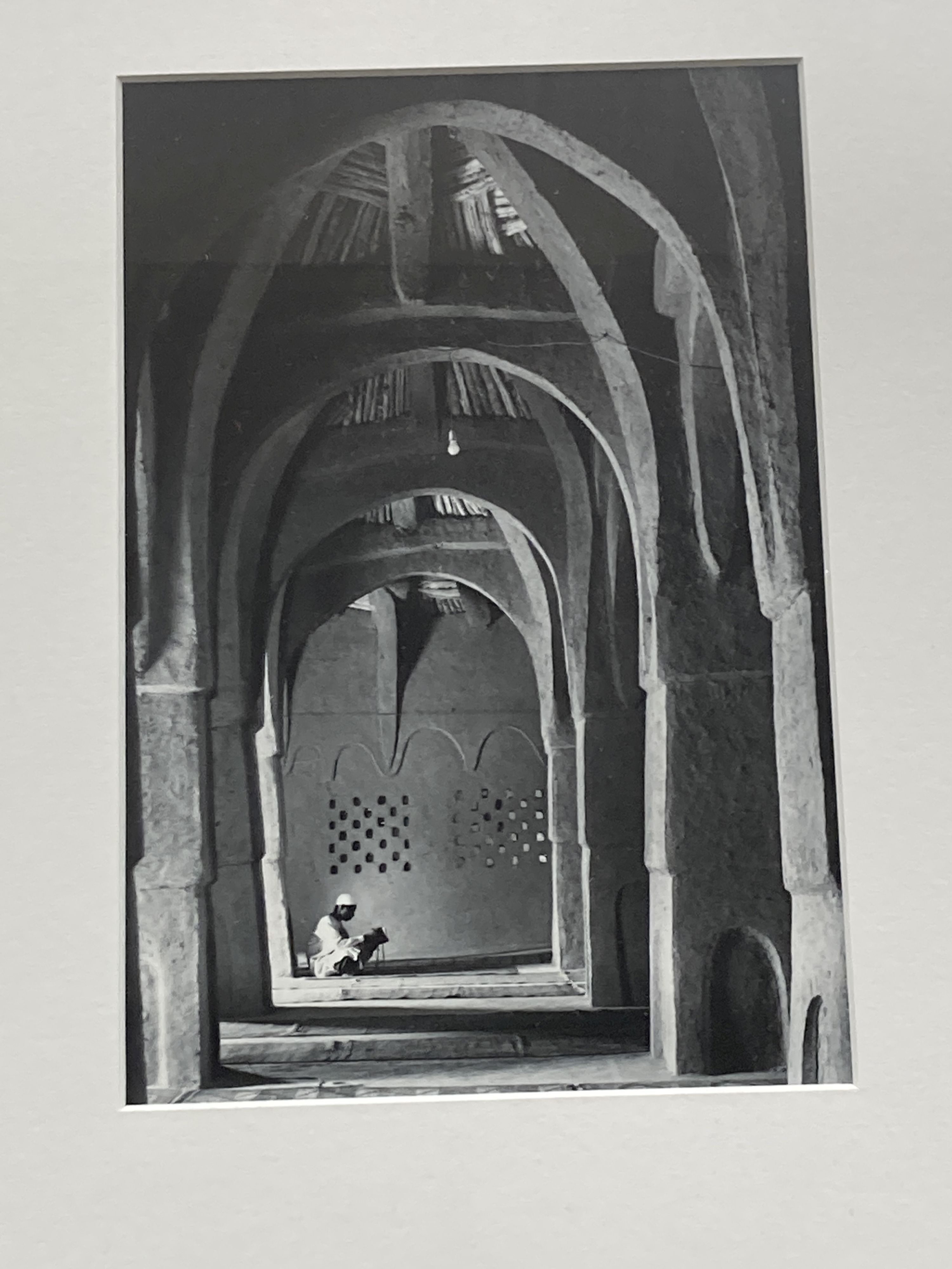 Three framed black and white photographs, North African mosque, Street scene and Fish traps, largest 26 x 17cm